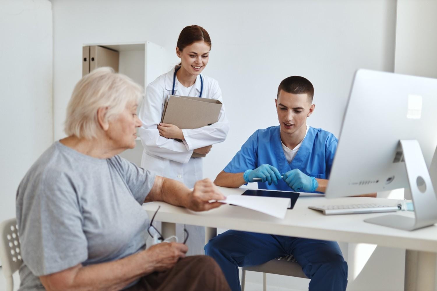 A healthcare provider reviewing medical coding records to improve patient care.