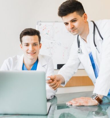 A medical coder working remotely in South Carolina with a laptop.