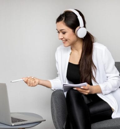 Healthcare Virtual Assistant Working Remotely with a Laptop and Headset