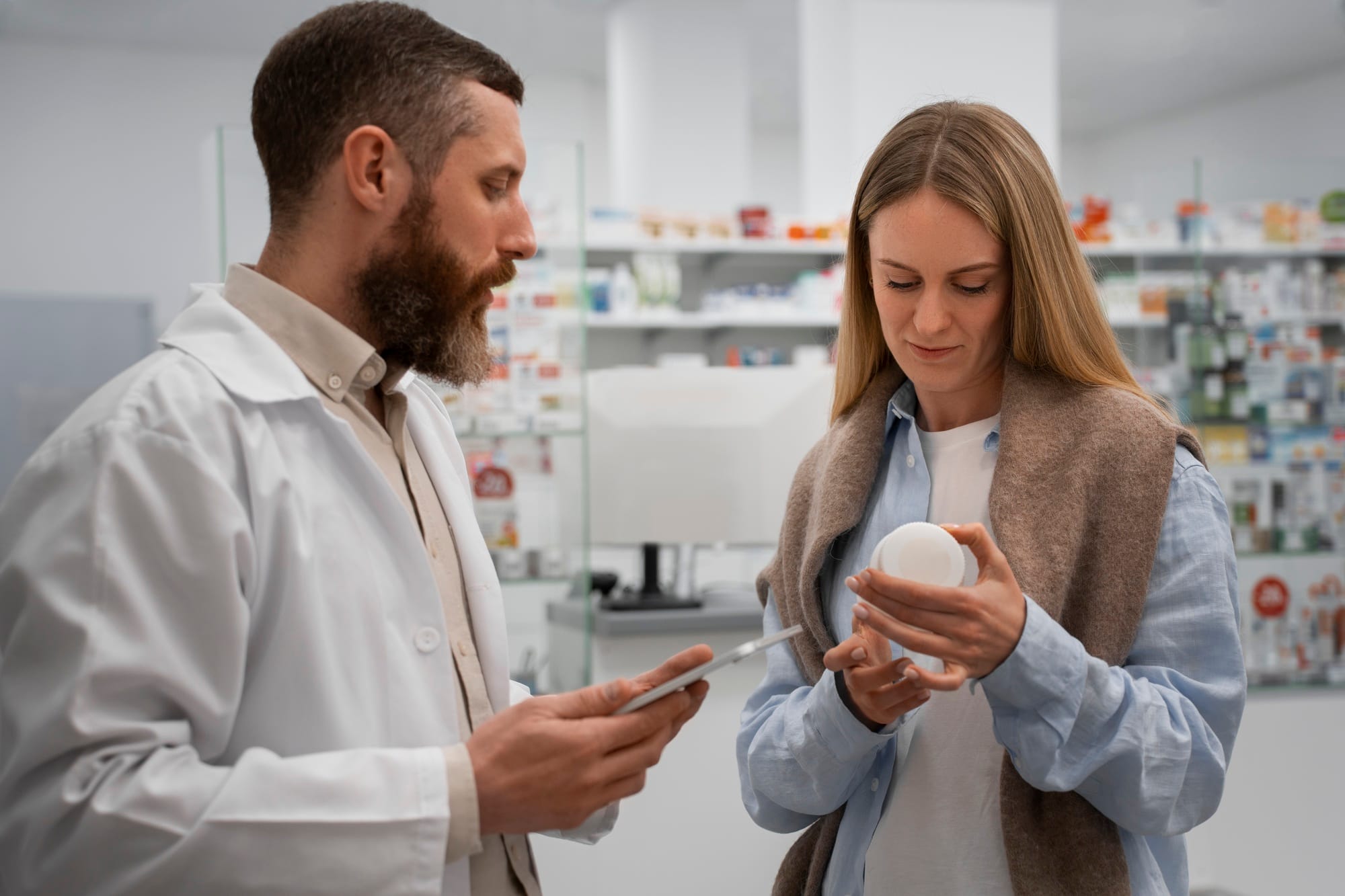 A billing expert reviewing LTC pharmacy claims on a computer.