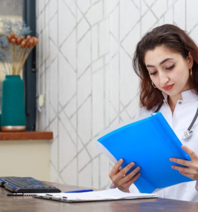 Healthcare provider in Maine reviewing prior authorization documents.