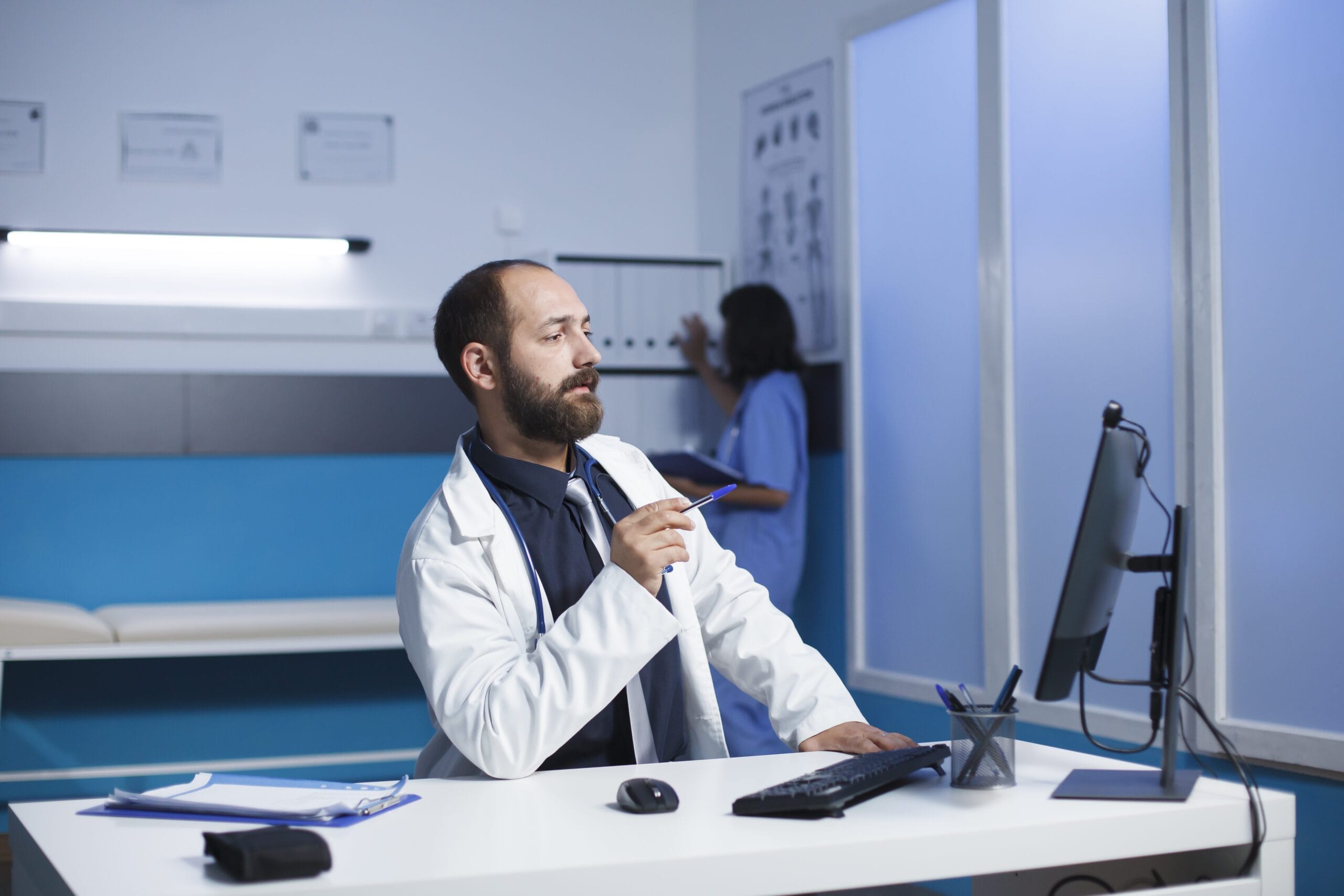 A medical scribe assisting a physician during patient care in New Jersey.