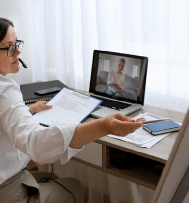 A Virtual Patient Support Specialist assisting a patient during an online consultation, showcasing seamless healthcare support remotely.