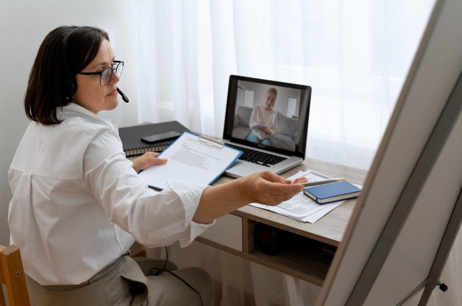 A Virtual Patient Support Specialist assisting a patient during an online consultation, showcasing seamless healthcare support remotely.