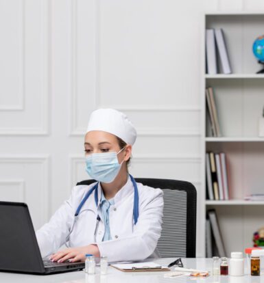 A doctor working with an EHR scribe in a Virginia medical practice.