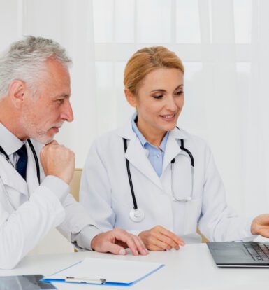 A healthcare provider reviewing medical codes with a virtual assistant.