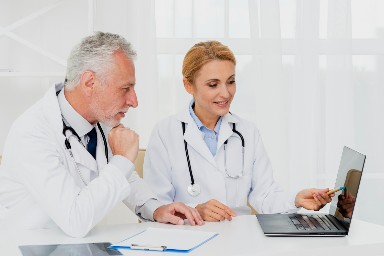 A healthcare provider reviewing medical codes with a virtual assistant.