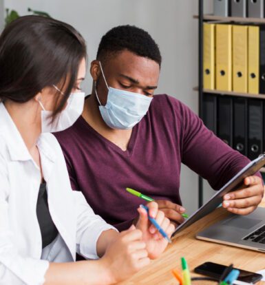 A healthcare professional analyzing medical coding data on a computer screen.