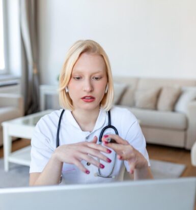 "Virtual medical assistant: Doctor using a laptop to provide telemedicine consultation"