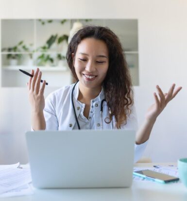 Virtual Healthcare Assistant providing remote medical support on a laptop.