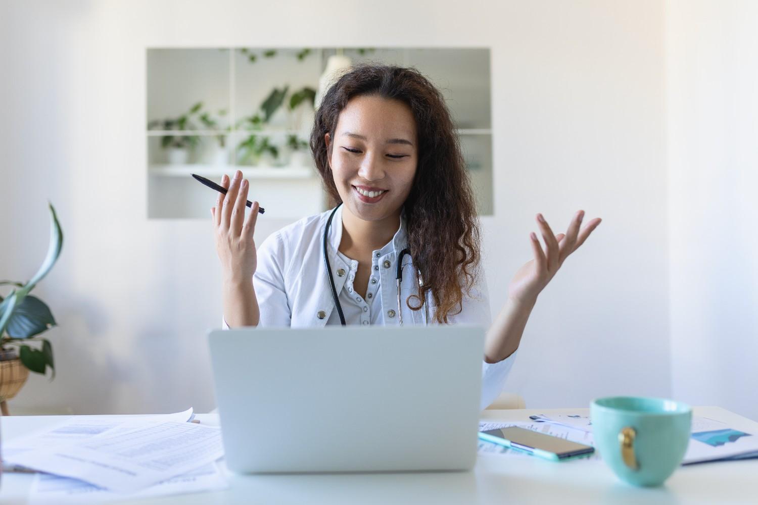 Virtual Healthcare Assistant providing remote medical support on a laptop.