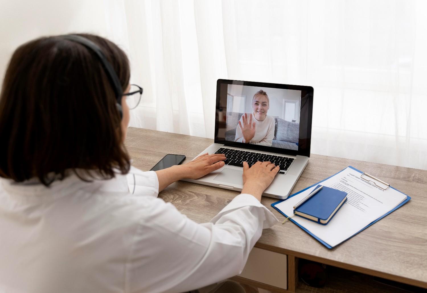 Virtual medical assistant providing online patient support via video call.