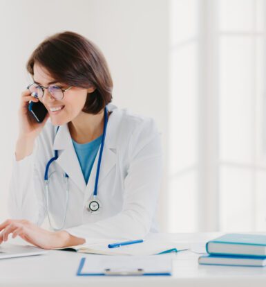 A healthcare professional using telemedicine outsourcing services for virtual patient care and administrative support.