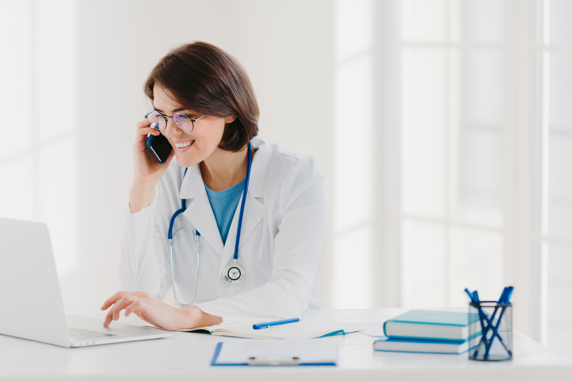 A healthcare professional using telemedicine outsourcing services for virtual patient care and administrative support.